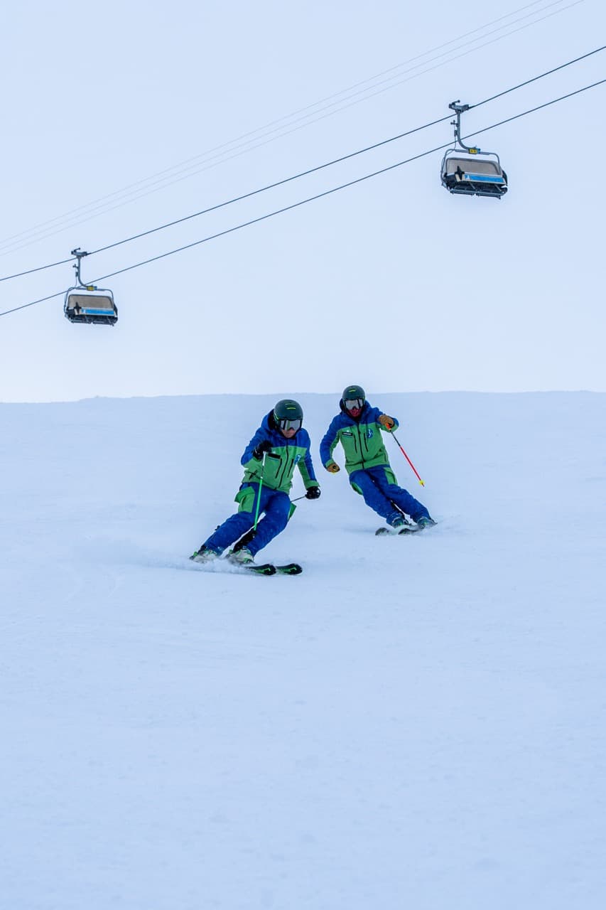 Ski instructor teaching on Zermatt slopes with Matterhorn in background