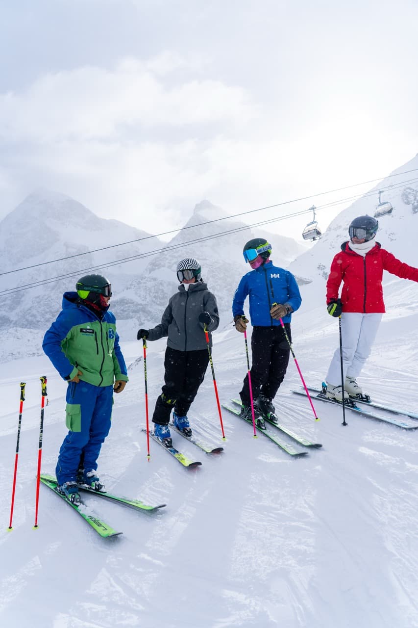 AB Ski School instructor with students at Zermatt mountain station